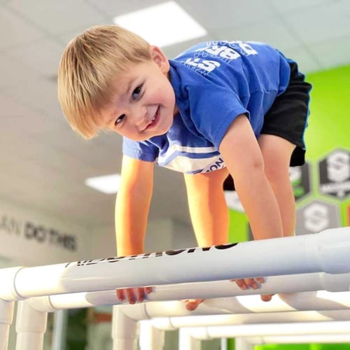 boy on parallettes